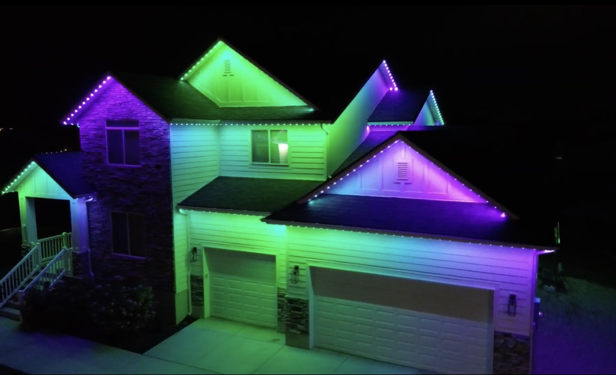 TruLight permanent lighting in Halloween orange and purple colors on a Utah home at night